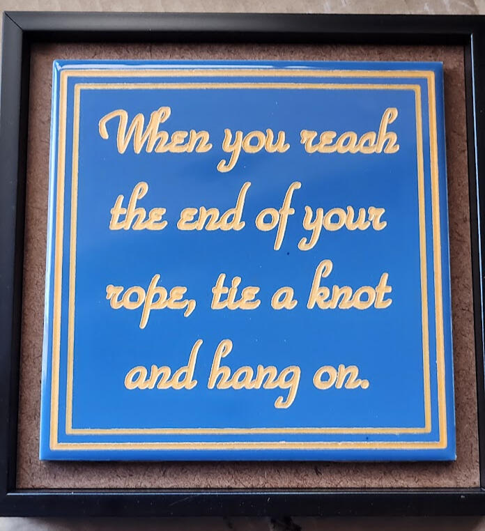 Engraved ceramic tile, paint filled